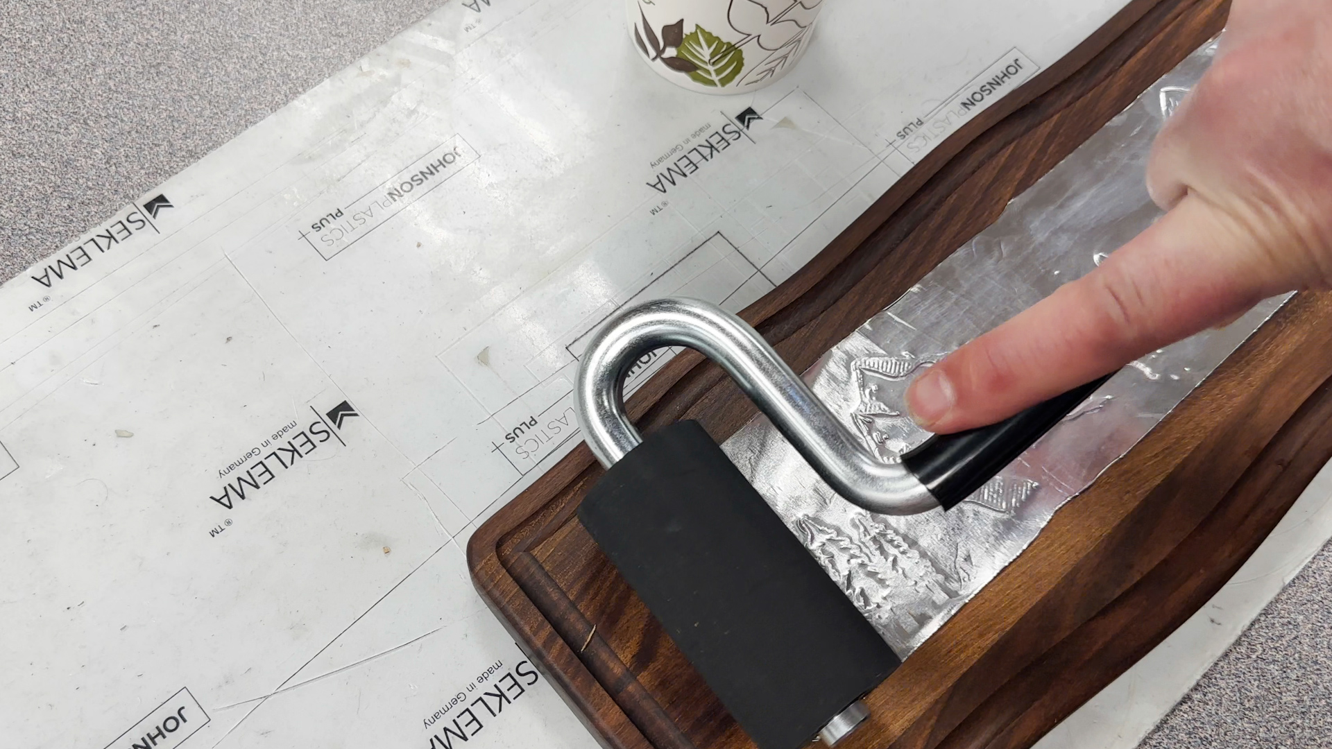 Roll veneer into pocket on cutting board