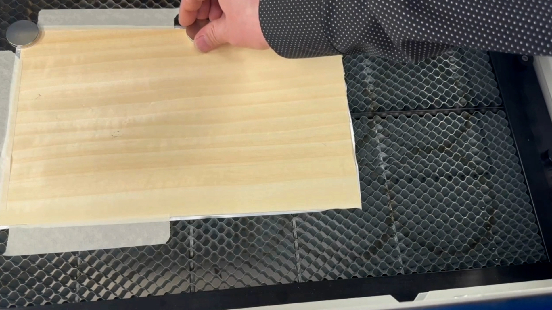 Secure veneer to laser engraver table